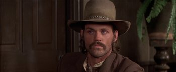 Movie still from “Pat Garrett & Billy the Kid” (1973), directed by Sam Peckinpah – A person wearing a hat; Close Up shot, Low angle