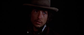 Movie still from “Pat Garrett & Billy the Kid” (1973), directed by Sam Peckinpah – A person wearing a hat; Close Up shot, Low angle