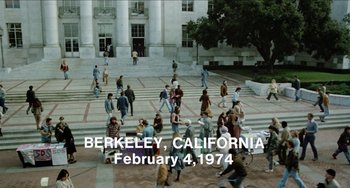 Movie still from “Patty Hearst” (1988), directed by Paul Schrader – A group of people walking on the steps of a building; Extreme Wide shot, High angle
