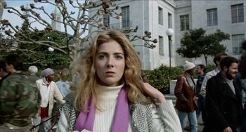 Movie still from “Patty Hearst” (1988), directed by Paul Schrader – A woman with a scarf around her neck; Close Up shot, Low angle
