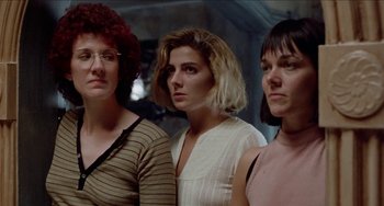 Movie still from “Patty Hearst” (1988), directed by Paul Schrader – A group of women standing next to each other; Close Up shot, Low angle