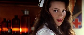 Movie still from “Pearl Harbor” (2001), directed by Michael Bay – A woman wearing a nurse's uniform; Close Up shot, Over the shoulder angle