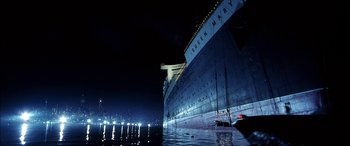 Movie still from “Pearl Harbor” (2001), directed by Michael Bay – A large boat in a body of water at night; Extreme Wide shot, Low angle