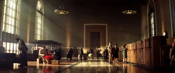 Movie still from “Pearl Harbor” (2001), directed by Michael Bay – A group of people standing in front of a door; Extreme Wide shot, Low angle