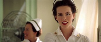 Movie still from “Pearl Harbor” (2001), directed by Michael Bay – A woman wearing a white shirt and a hat; Close Up shot, Low angle