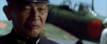 Movie still from “Pearl Harbor” (2001), directed by Michael Bay – An older man wearing a uniform and a hat; Close Up shot, Low angle