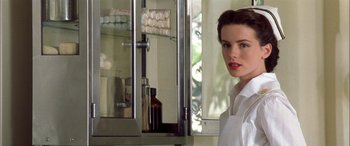 Movie still from “Pearl Harbor” (2001), directed by Michael Bay – A woman standing in front of a medicine cabinet; Close Up shot, Low angle