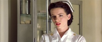 Movie still from “Pearl Harbor” (2001), directed by Michael Bay – A woman wearing a white uniform and a white hat; Close Up shot, Low angle