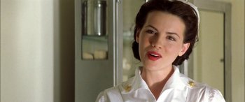 Movie still from “Pearl Harbor” (2001), directed by Michael Bay – A person wearing a white shirt; Close Up shot, Over the shoulder angle
