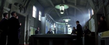 Movie still from “Pearl Harbor” (2001), directed by Michael Bay – A group of men standing around a table in a room; Extreme Wide shot, Low angle