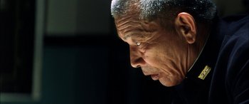 Movie still from “Pearl Harbor” (2001), directed by Michael Bay – An older man looking down at his face; Close Up shot, Low angle