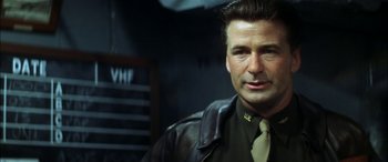 Movie still from “Pearl Harbor” (2001), directed by Michael Bay – A person wearing a leather jacket and tie; Close Up shot, Low angle
