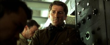 Movie still from “Pearl Harbor” (2001), directed by Michael Bay – A person wearing headphones on a bus; Close Up shot, Low angle