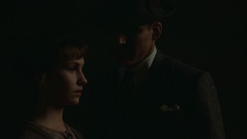 Movie still from “Pennies from Heaven” (1981), directed by Herbert Ross – A man and a woman standing next to each other in the dark; Close Up shot, Over the shoulder angle