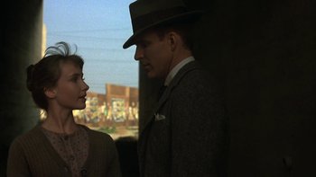 Movie still from “Pennies from Heaven” (1981), directed by Herbert Ross – A man and a woman standing next to each other; Close Up shot, Over the shoulder angle