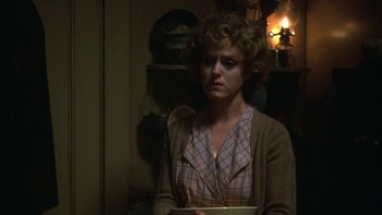 Movie still from “Pennies from Heaven” (1981), directed by Herbert Ross – A woman in a plaid shirt holding a bowl; Close Up shot, Low angle