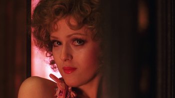 Movie still from “Pennies from Heaven” (1981), directed by Herbert Ross – A person with curly hair; Close Up shot, Over the shoulder angle