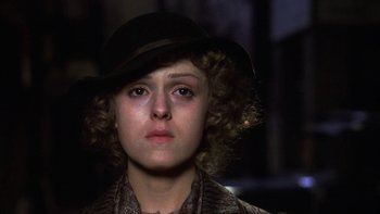 Movie still from “Pennies from Heaven” (1981), directed by Herbert Ross – A person wearing a hat; Close Up shot, Low angle
