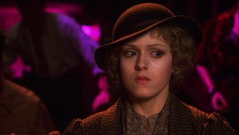 Movie still from “Pennies from Heaven” (1981), directed by Herbert Ross – A woman in a hat and a brown jacket; Close Up shot, Over the shoulder angle
