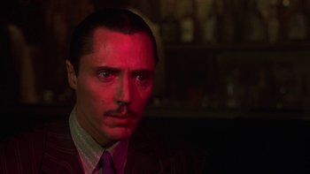 Movie still from “Pennies from Heaven” (1981), directed by Herbert Ross – A person wearing a suit and tie; Close Up shot, Low angle