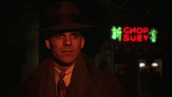 Movie still from “Pennies from Heaven” (1981), directed by Herbert Ross – A man wearing a hat and a coat; Close Up shot, Low angle