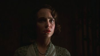 Movie still from “Pennies from Heaven” (1981), directed by Herbert Ross – A woman with a necklace is looking at the camera; Close Up shot, Low angle
