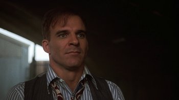 Movie still from “Pennies from Heaven” (1981), directed by Herbert Ross – A person wearing a shirt and tie; Close Up shot, Low angle