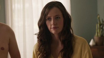 Movie still from “People Places Things” (2015), directed by Jim Strouse – A person with long hair; Close Up shot, Over the shoulder angle