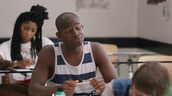 Movie still from “People Places Things” (2015), directed by Jim Strouse – A man sitting at a table with food in front of him; Close Up shot, Over the shoulder angle