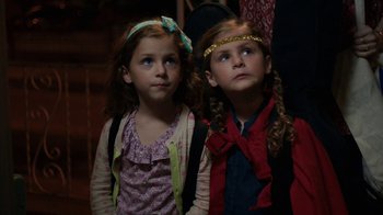 Movie still from “People Places Things” (2015), directed by Jim Strouse – Two little girls standing next to each other looking up; Close Up shot, High angle
