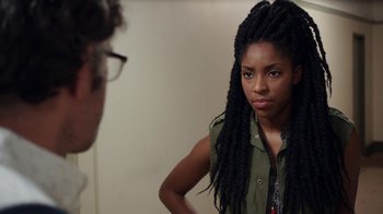 Movie still from “People Places Things” (2015), directed by Jim Strouse – A woman standing in front of a man in front of a mirror; Close Up shot, Over the shoulder angle