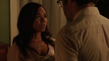 Movie still from “People Places Things” (2015), directed by Jim Strouse – A woman and a man standing next to each other; Close Up shot, Over the shoulder angle