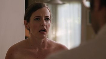 Movie still from “People Places Things” (2015), directed by Jim Strouse – A woman looking in the mirror in front of a window; Close Up shot, Over the shoulder angle