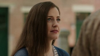 Movie still from “People Places Things” (2015), directed by Jim Strouse – A person with long brown hair; Close Up shot, Over the shoulder angle