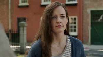 Movie still from “People Places Things” (2015), directed by Jim Strouse – A person with long brown hair; Close Up shot, Over the shoulder angle