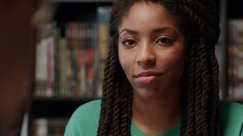 Movie still from “People Places Things” (2015), directed by Jim Strouse – A person wearing a green shirt; Close Up shot, Over the shoulder angle