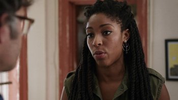 Movie still from “People Places Things” (2015), directed by Jim Strouse – A person with dreadlocks; Close Up shot, Over the shoulder angle