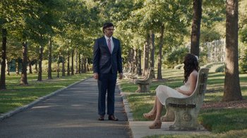Movie still from “People Places Things” (2015), directed by Jim Strouse – A man and a woman sitting on a park bench; Wide shot, Over the shoulder angle