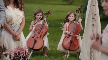 Movie still from “People Places Things” (2015), directed by Jim Strouse – Two little girls are playing their musical instruments outside; Wide shot, High angle