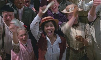 Movie still from “Pete's Dragon” (1977), directed by Don Chaffey – A group of people wearing hats and laughing; Medium shot, Low angle