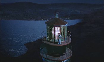 Movie still from “Pete's Dragon” (1977), directed by Don Chaffey – A man standing on top of a light house; Extreme Wide shot, High angle