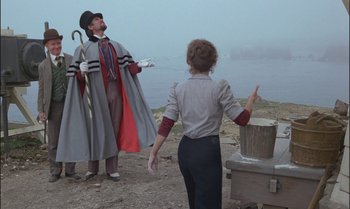 Movie still from “Pete's Dragon” (1977), directed by Don Chaffey – A man and a woman dressed in costumes; Wide shot, Low angle