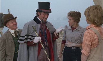 Movie still from “Pete's Dragon” (1977), directed by Don Chaffey – A man and a woman dressed up in costume; Medium shot, Over the shoulder angle