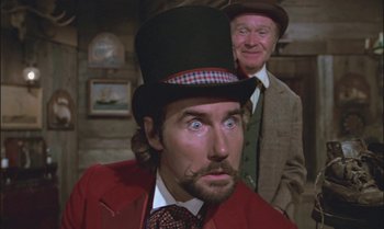 Movie still from “Pete's Dragon” (1977), directed by Don Chaffey – A man in a top hat and a man in a red jacket; Close Up shot, Low angle