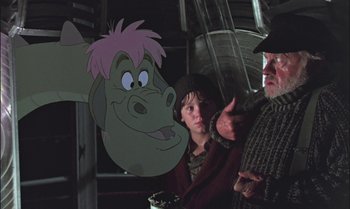 Movie still from “Pete's Dragon” (1977), directed by Don Chaffey – A man and a boy are looking at an animated character; Medium shot, Over the shoulder angle