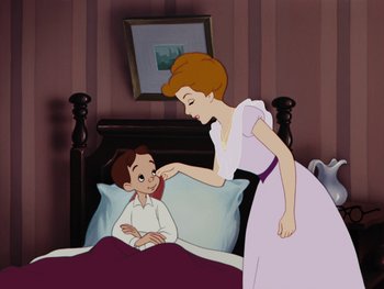 Movie still from “Peter Pan” (1953), directed by Jack Kinney – An animated scene of a woman helping a boy in bed; Medium shot, High angle
