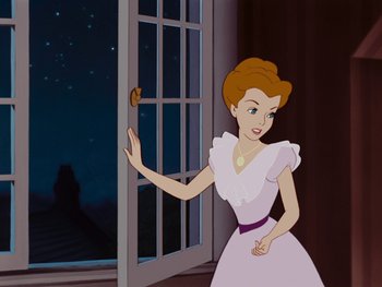 Movie still from “Peter Pan” (1953), directed by Jack Kinney – A woman in a white dress holding a cookie; Medium shot, Over the shoulder angle