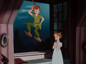 Movie still from “Peter Pan” (1953), directed by Jack Kinney – A girl standing in front of an image of peter pan; Wide shot, High angle
