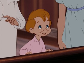 Movie still from “Peter Pan” (1953), directed by Jack Kinney – A little boy sitting in front of a mirror; Close Up shot, High angle