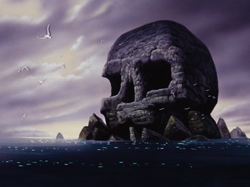 Movie still from “Peter Pan” (1953), directed by Jack Kinney – A painting of a giant skull on a rocky island in the middle of the ocean; Extreme Wide shot, Low angle